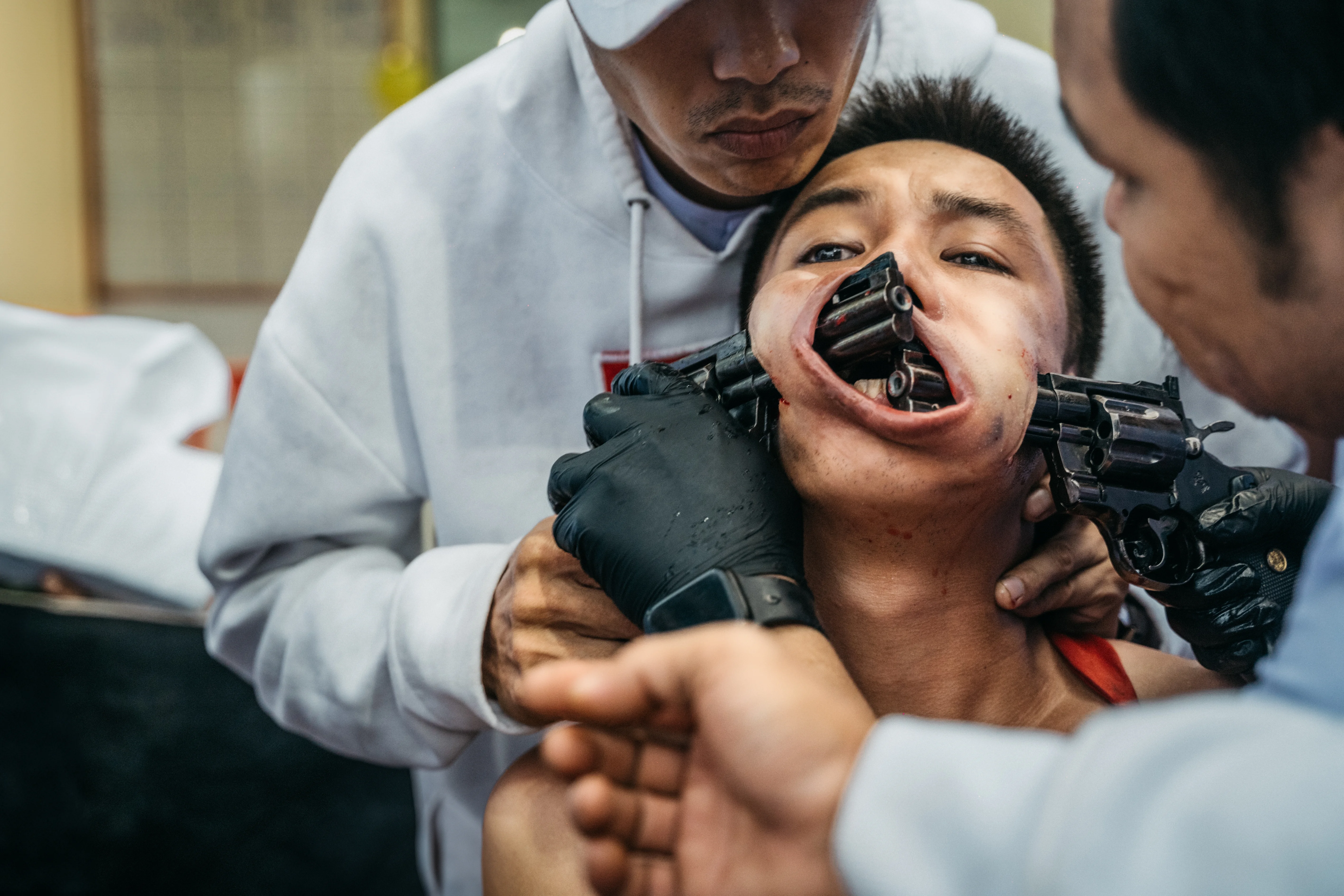 The man with two guns in his mouth